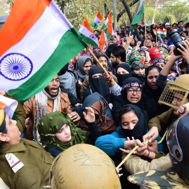Police and demonstrators scuffle during a protest against discriminatory citizenship laws outside Jamia University in Delhi.