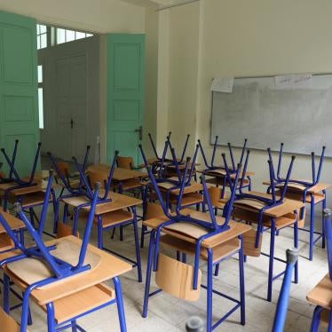 Chairs are placed on classroom tables at a closed public school in Beirut.