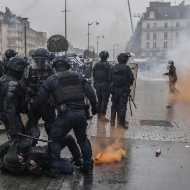 Riot police scuffle with protesters during a protest in Rennes, France.