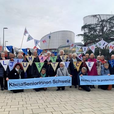 A group from the Senior Women for Climate Protection association hold banners outside the European Court of Human Rights in Strasbourg, France.