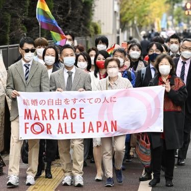Plaintiffs and supporters of marriage equality for same sex couples walk to the Tokyo district court.