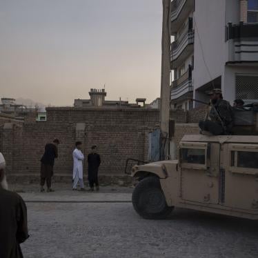 Taliban fighters ride atop a Humvee after detaining four men in Kabul, Afghanistan.