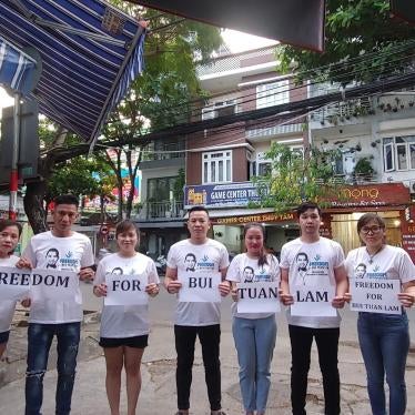The wife, two brothers, and friends of Bui Tuan Lam gather in Da Nang city, Vietnam, to demand his freedom, May 2023.