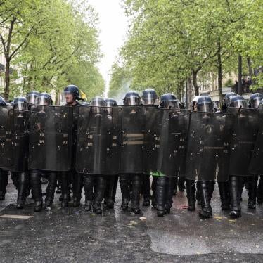 Riot police from the Gendarmerie Mobile advance in line as thousands of demonstrators take part in the traditional May Day demonstration, Paris, France.
