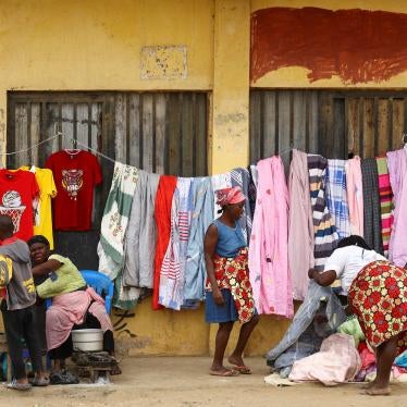 Street vendors serve customers in Luanda, Angola, August 20, 2022. 