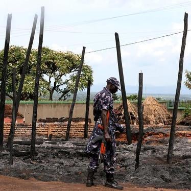 A Ugandan policeman guards the remains of the destroyed palace of Charles Wesley Mumbere, king of the Rwenzururu, after Uganda security forces stormed the compound in Kasese town, western Uganda on November 27, December 1, 2016.
