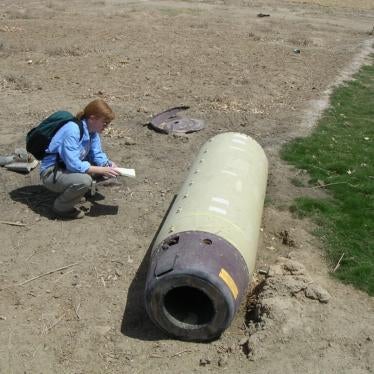 Bonnie Docherty examining a US ATACMS cluster munition outside of al-Hilla dropped on Iraq in May 2003.