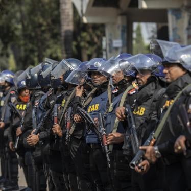 Bangladesh's Rapid Action Battalion soldiers stand on guard during the demonstration in Dhaka, December 10, 2022.