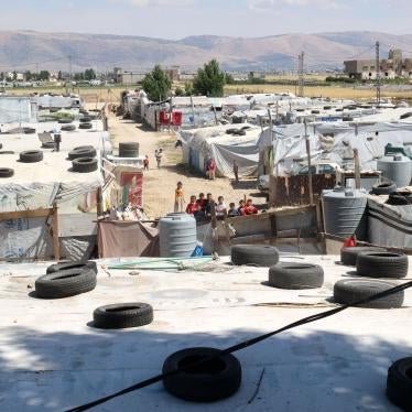 Syrian children gather between tents at a refugee camp in Saadnayel in eastern Lebanon's Bekaa Valley, June 13, 2023.