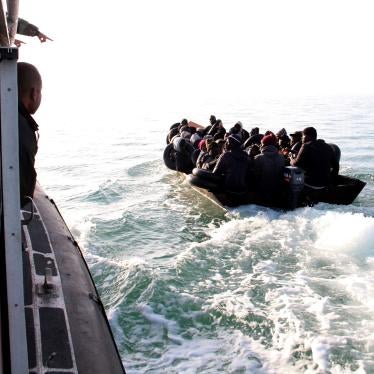The Tunisian Maritime National Guard (coast guard) approaches a boat at sea carrying people from different African countries seeking to get to Italy, near the coast of Sfax, Tunisia, Tuesday, April 18, 2023. © 2023 AP Photo