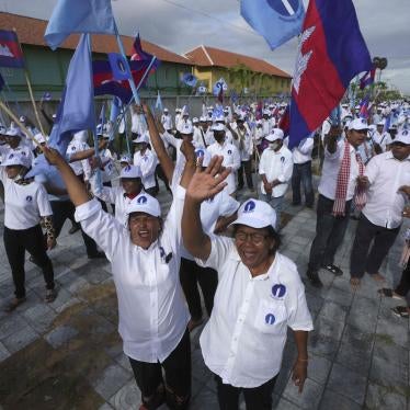 Cambodia's Candlelight Party supporters wave before marching during an election campaign for the June 5 communal elections in Phnom Penh, Cambodia, May 21, 2022.