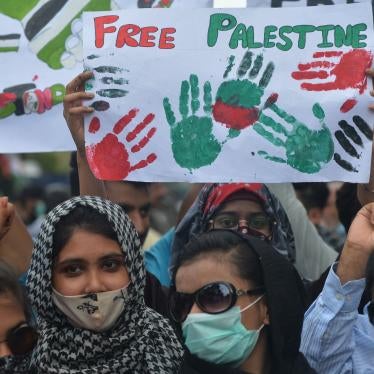 Demonstrators hold placards that read "Free Palestine"