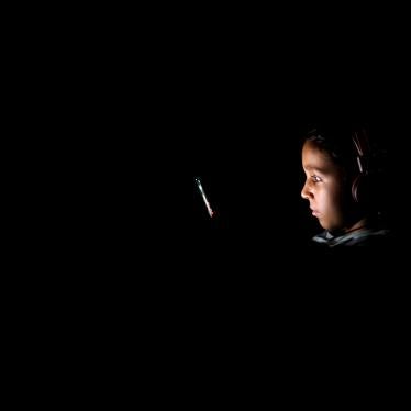 A child looks at a mobile phone during planned load shedding that the government has begun to overcome the pressure on electricity demand due to increased consumption amid a heatwave in Cairo, Egypt, July 23, 2023. 