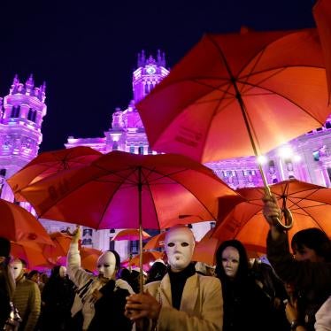 Sex workers wear masks while asking for the clubs where they work not to close, during an event on International Women's Day in Madrid, Spain, March 8, 2023.