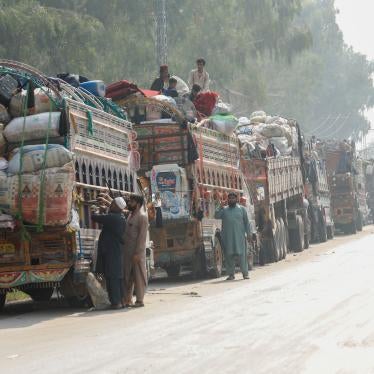 Trucks loaded with the belongings of Afghan refugees who are being forced to leave Pakistan outside the United Nations refugee agency repatriation centers in Azakhel town in Nowshera, Pakistan, October 30, 2023. 