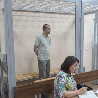 Abduqodir Muminov in the defendant's cage in a courtroom in Tashkent, Uzbekistan, July 2023.