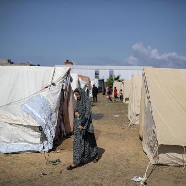 A girl walks around tents at a camp set up by the United Nations Relief and Works Agency for Palestine Refugees (UNRWA) for Palestinians who fled to the southern Gaza Strip, October 19, 2023. 