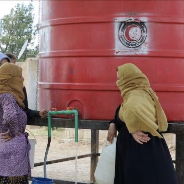 Residents of al-Hasakeh city gather around a communal water tank to fill up Jerry cans and buckets with water for their daily needs as they hardly get any water from the city’s water network due to longstanding water disputes, al-Hasakeh city, northeast Syria, May 8, 2023.
