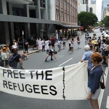 Activists gather in Brisbane's ANZAC Square to protest the indefinite detention of refugees and asylum seekers in Australian-run and funded facilities on the mainland and on Papua New Guinea's Manus Island, January 19, 2022.