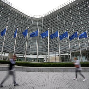 European Union flags wave in the wind as pedestrians walk by EU headquarters in Brussels, Wednesday, Sept. 20, 2023.