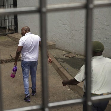 Zimbabwean opposition politician Job Sikhala enters the holding cells at the magistrates court in Harare, Zimbabwe