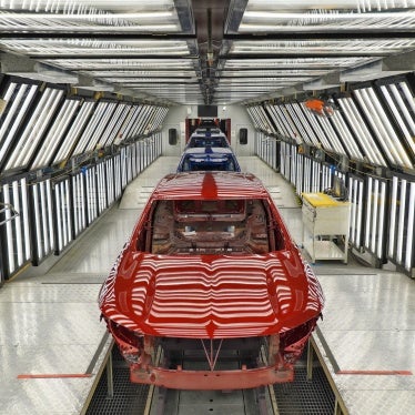 Cars are delivered on a production line