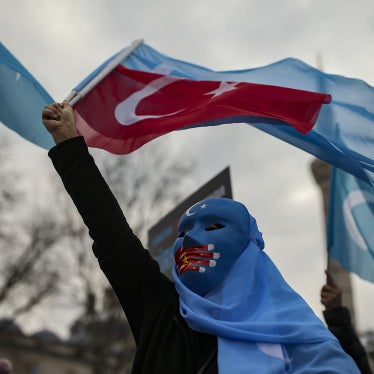 A person from the Uyghur community living in Türkiye protests against the visit of China's Foreign Minister Wang Yi to Türkiye, in Istanbul, March 25, 2021. 