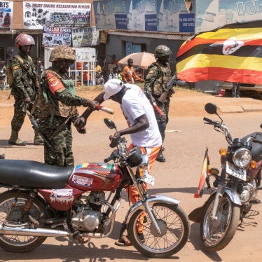 Uganda military police officer assaults opposition supporter