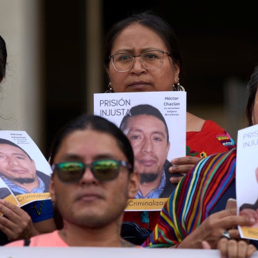 Activists hold portraits of jailed Indigenous leaders Luis Pacheco and Héctor Chaclán, who face charges of terrorism and illicit association in connection with nationwide protests in 2023, as they call for their release outside the Supreme Court in Guatemala City, August 25, 2025.
