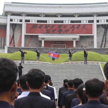 People in North Korea participate in a mass rally.