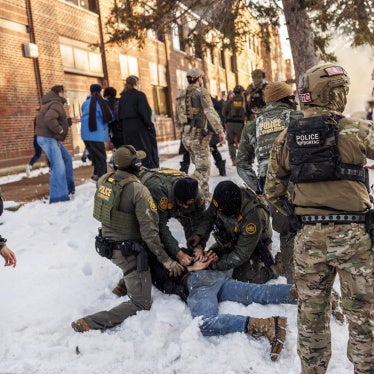 US Border Patrol agents detain a person near Roosevelt High School during dismissal time as federal immigration enforcement actions sparked protests in Minneapolis, Minnesota, on January 7, 2026. 