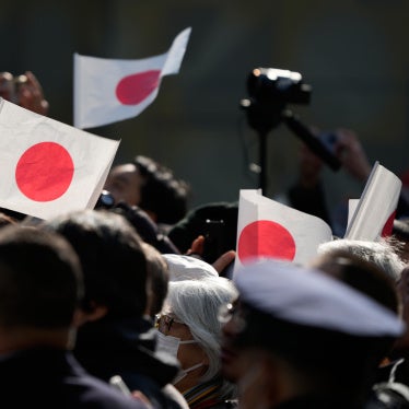 People wave Japanese flag in Tokyo, January 27, 2026.