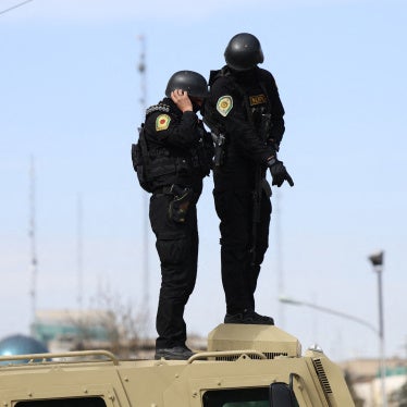 Iranian security forces stand guard on top of an armored vehicle in Tehran on March 21, 2026.