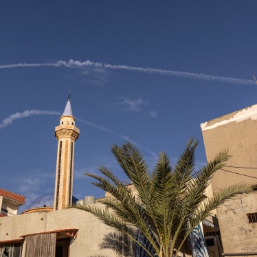 Contrails from Israeli fighter jets in the sky over Tyre, Lebanon, March 24, 2026.