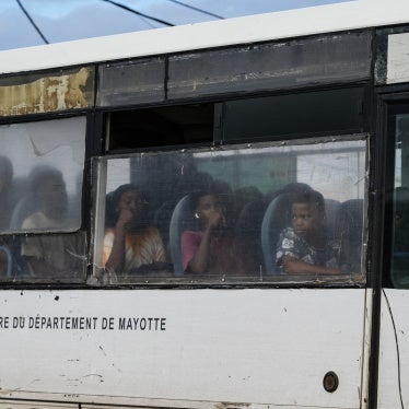 Students sit aboard a school bus, in Kaweni, in the township of Mamoudzou, in the French Indian Ocean territory of Mayotte, on October 28, 2025. 