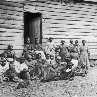 Formerly enslaved people sit at Foller's House in Cumberland Landing, Virginia, US, circa 1850.