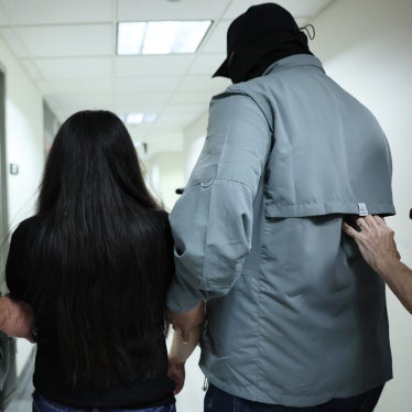 A woman is detained by US federal agents after exiting a court hearing in immigration court at the Jacob K. Javits Federal Building in New York City, on September 3, 2025.