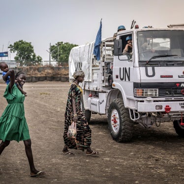Residents react as they walk past a patrol truck operated by Indian peacekeepers serving with the United Nations Mission in South Sudan (UNMISS) in the strategic town of Akobo, Jonglei State, on February 12, 2026.
