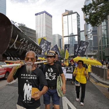 Koo Sze-yiu carries a coffin that reads, “The people’s heroes, they shall remain forever immortal" at a protest in Hong Kong, May 26, 2019