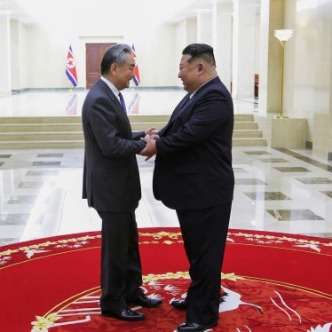 North Korean leader Kim Jong Un (right) greets Chinese Foreign Minister Wang Yi in Pyongyang, North Korea, on February 10, 2026.
