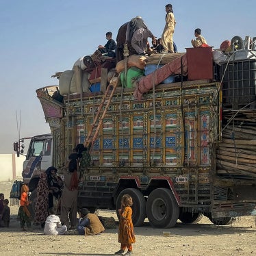 Afghan refugees board a truck with their belongings as they await deportation at the Pakistan-Afghanistan border in Chaman on October 19, 2025.