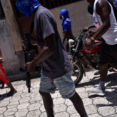 Children accompany criminal group members in a march in the Delmas neighborhood of Port-au-Prince, Haiti, May 10, 2024.