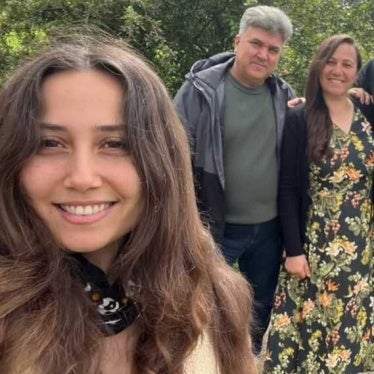Environmental activist Esra Isik, with her parents.