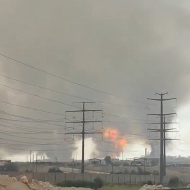 Smoke rising from a refinery