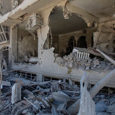 Debris tumbles from a residential building hit in an airstrike  on March 30, 2026 in Tehran, Iran. 
