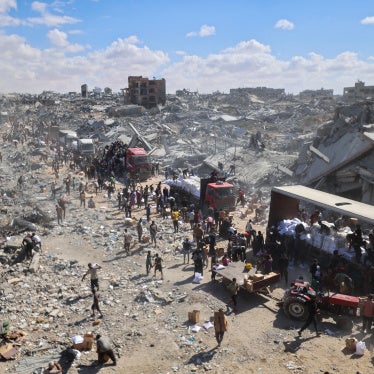 Aid trucks enter the Kerem Abu Salem crossing in Khan Younis, Gaza, October 12, 2025.