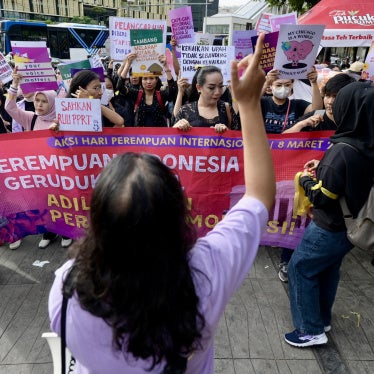 People rally on International Women's Day in Jakarta demanding the Indonesian government pass an anti-discrimination law and ratify the International Labor Organization (ILO) convention concerning the elimination of sexual violence and harassment at work, March 8, 2024.