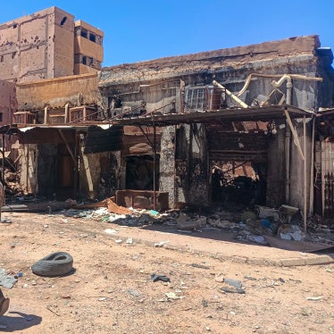 A fighter loyal to the army patrols a market area in Khartoum on March 24, 2025.