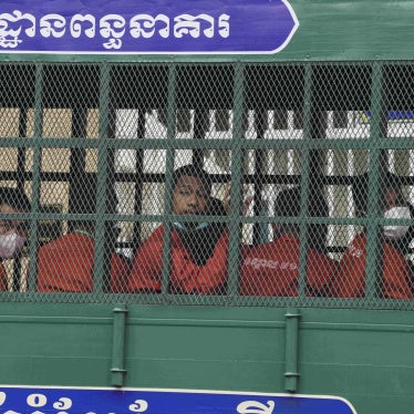 People on a prison truck arrive at the Municipal Court in Phnom Penh, Cambodia, March 17, 2022.
