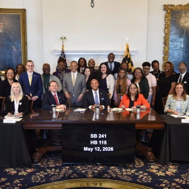 Maryland Governor Wes Moore (center) along with advocates, organizers, and legislators after signing HB 115 and SB 241 at the Maryland State House in Annapolis, May 12, 2026. 